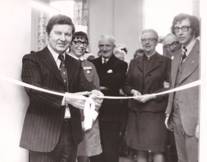 Photograph of Richard Baker cutting a ribbon 