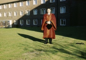 Dr McMillan in cap and gown outside St Luke's Hospital